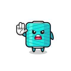 yarn spool character doing stop gesture