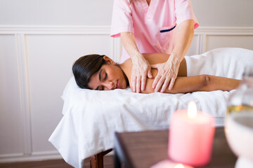 Obraz na płótnie Canvas Calm latin woman enjoying a spa treatment