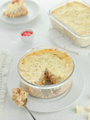 Delicious cheese macaroni mixed with beef and sausage topped with sauce