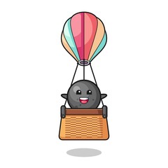 cannon ball mascot riding a hot air balloon
