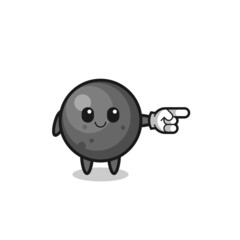 cannon ball mascot with pointing right gesture