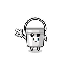 metal bucket mascot pointing top left