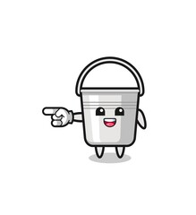 metal bucket cartoon with pointing left gesture