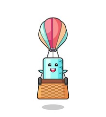 ruler mascot riding a hot air balloon