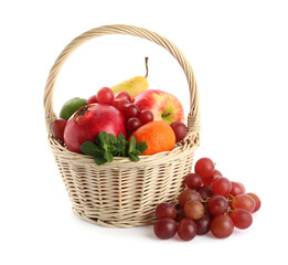 Wicker basket with different ripe fruits on white background