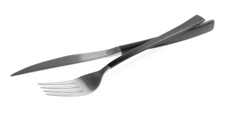 New fork and knife with black handles on white background