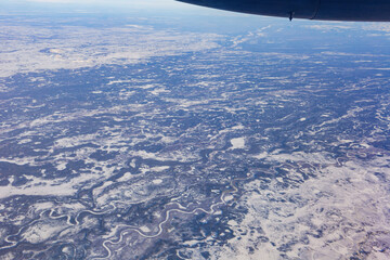 Naklejka na ściany i meble Aerial view of some snowy river landscape at Anchorage