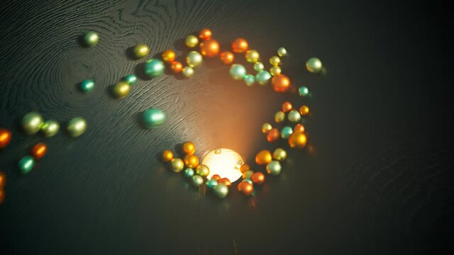 Multicolor shiny pastel balls roll on a dark wooden surface. Stuck. Blockage.