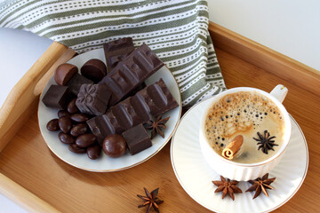 A cup of hot coffee and chocolate. Lifestyle concept.
Cozy winter breakfast.