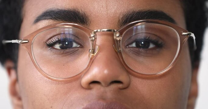 Close up cropped face view African woman in glasses smile look at camera. Eyesight and vision care, happy client of clinic check up professional services, spectacles lenses store advertisement concept