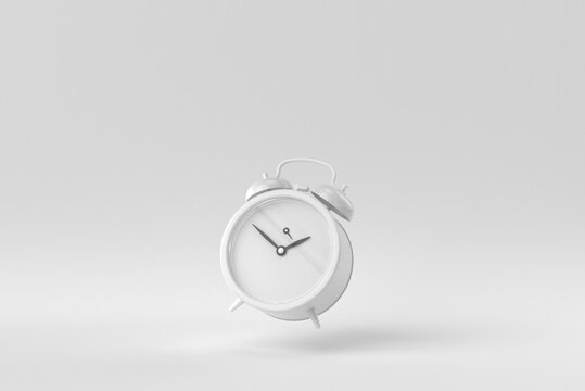 Retro alarm clock on a white background. minimal concept. monochrome. 3D render.