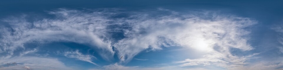 Blue sky panorama with Cirrus clouds in Seamless spherical equirectangular format. Full zenith for use in 3D graphics, game and editing aerial drone 360 degree panoramas for sky replacement.