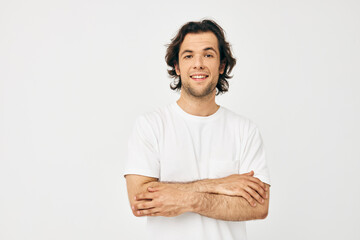 handsome man in white t-shirt fashion cropped view light background