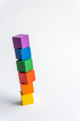 Six colored wooden blocks vertical on white background. Index or infographic 6 with copy space. Toy Blocks, Wooden Cube Bricks