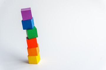 Six colored wooden blocks vertical on white background. Index or infographic 6 with copy space. Toy...