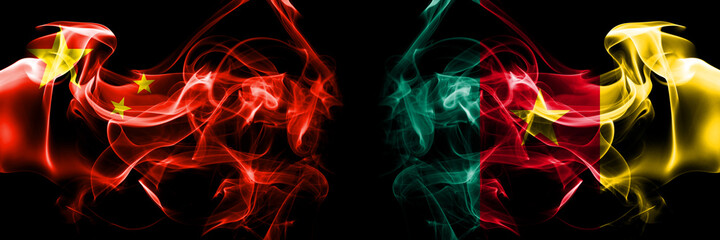 Obraz premium Flags of China, Chinese vs Cameroon, Cameroonian. Smoke flag placed side by side on black background.