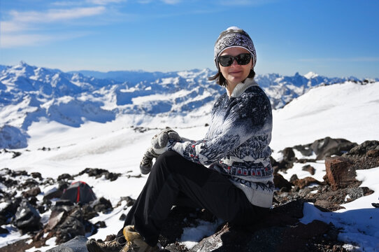 Portrait of a young woman on the background of Elbrus mountains, Russia