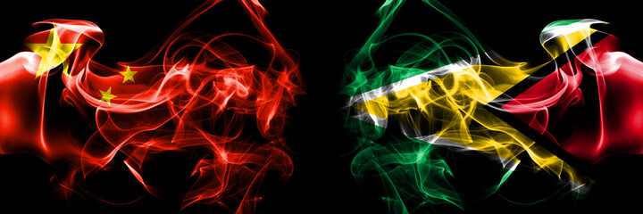 Flags of China, Chinese vs Guyana. Smoke flag placed side by side on black background.