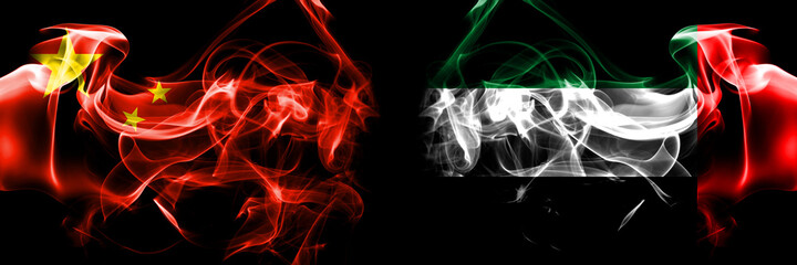 Flags of China, Chinese vs United Arab Emirates, Emirati. Smoke flag placed side by side on black background.