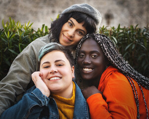Portrait of multiracial diverse young woman smiling and looking at the camera - obrazy, fototapety, plakaty