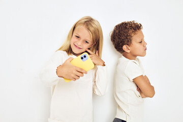 Portrait of his he her with yellow phone entertainment isolated background