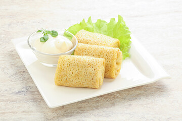 Stuffed pancakes with meat and cream