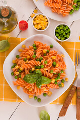 Fusilli pasta with peas and sweet corn.

