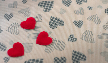 Valentine's day. red hearts on heart craft paper background. The holiday is February 14. Romantic love background for the Valentine's day concept. Space for text. flat lay, top view. Empty space text.