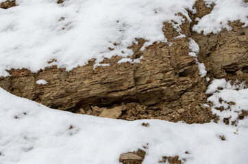 A rock that shatters after frost