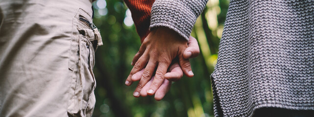 Banner header Close up of man and woman couple hands holding each other together with love and...