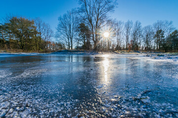frozen lake during a sunny day (Brandenburg, Germany)