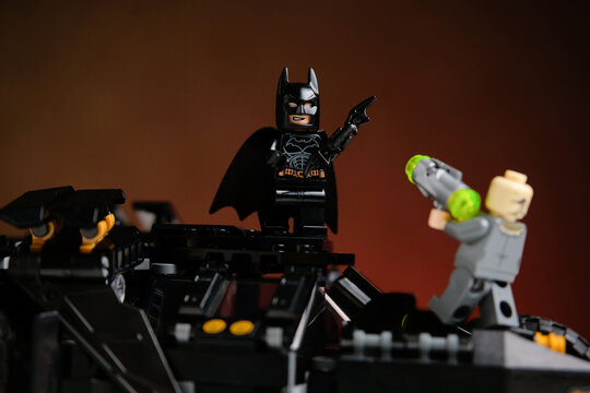 Togliatti, Russia - january 1, 2022: Lego Batman dark knight minifigure and batmobile.