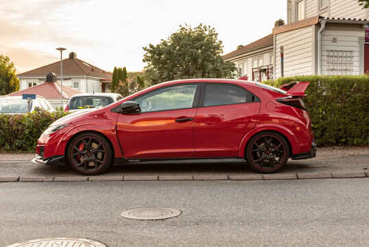 Gothenburg, Sweden - July 01 2021: Side view of a red Honda Civic Type R.