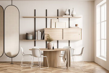 Light guest room interior with chairs and round table near window