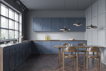 On trend blue and grey kitchen with dining table