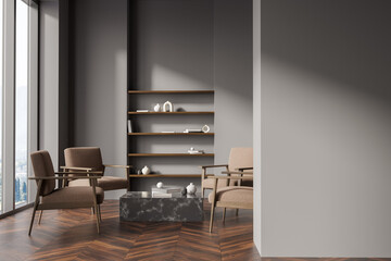 Fototapeta premium Dark living room interior with empty grey wall, four armchairs