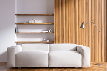 Bright living room interior with sofa, shelves with books, crockery