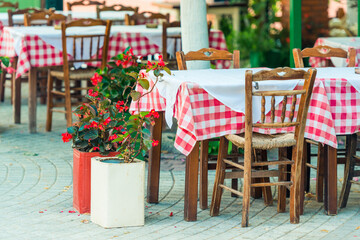 Range of wooden table and chair for relaxation at restaurant near sea