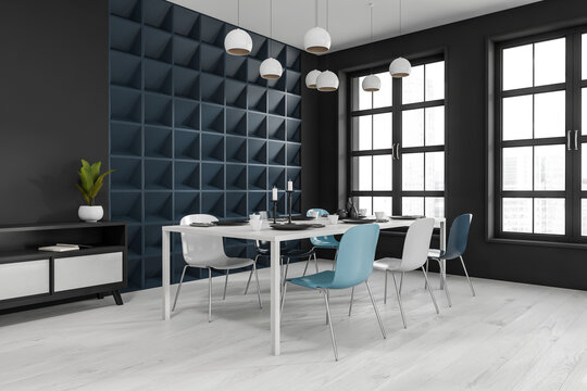Black and white dining interior with six seats, drawer and table near window