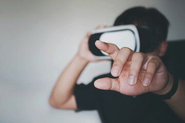 Young bearded man wearing virtual reality glasses in modern interior design coworking studio,VR, future, gadgets, technology concept.