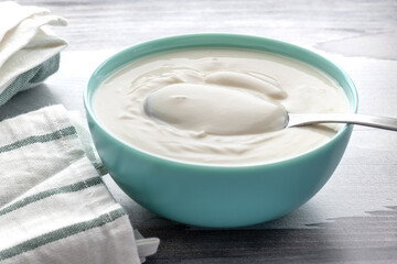Fototapeta na wymiar greek yogurt in ceramic bowl, dairy free, gluten free, probiotic food for good gut health