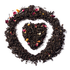 Heart shaped heap of loose-leaf black tea. Isolated on white background.