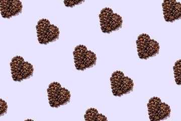 Heart shaped heaps of coffee beans. Seamless repeating pattern.