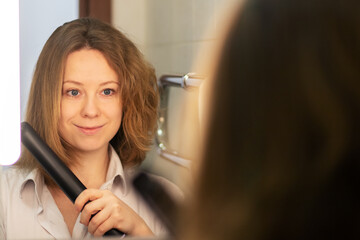 hair straightening,woman with before and after in the bathroom