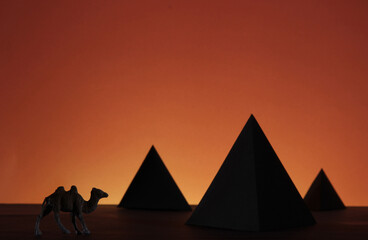 Fototapeta na wymiar Egypt pyramid with camel in sunset