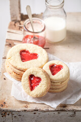 Cute biscuits for valentine made of butter and strawberries jam.