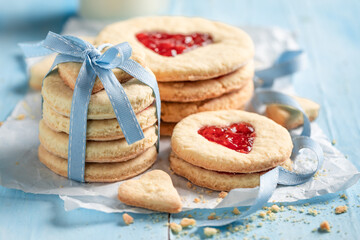 Sweet valentine cookies with heart shape and red jam.