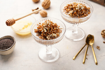Traditional east european (ukrainian, polish, belarusian) religious christmas dish kutia made of wheat, poppy seeds, honey, walnuts and dried berries. modern style in champagne glasses