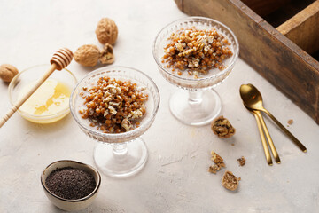 Traditional east european (ukrainian, polish, belarusian) religious christmas dish kutia made of wheat, poppy seeds, honey, walnuts and dried berries. modern style in champagne glasses