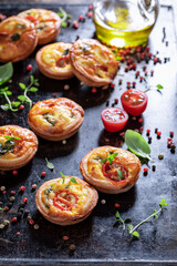 Homemade mini tart with cheese and tomatoes. Appetizer for vegan.